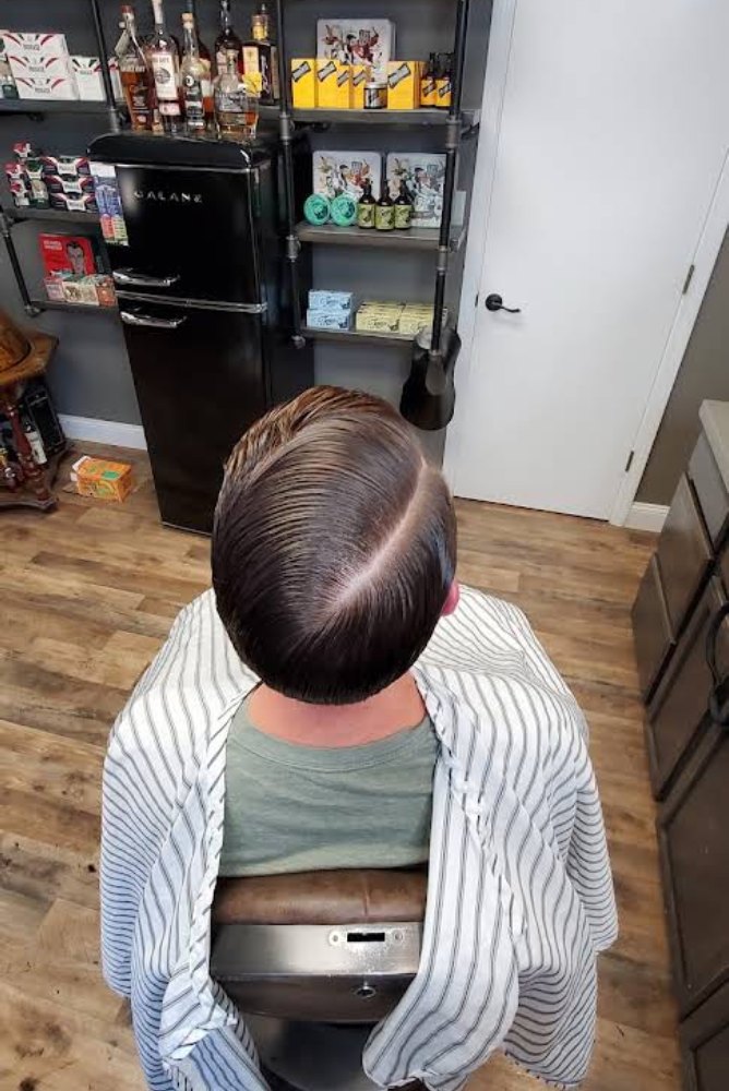 Side part with a hard line, from above